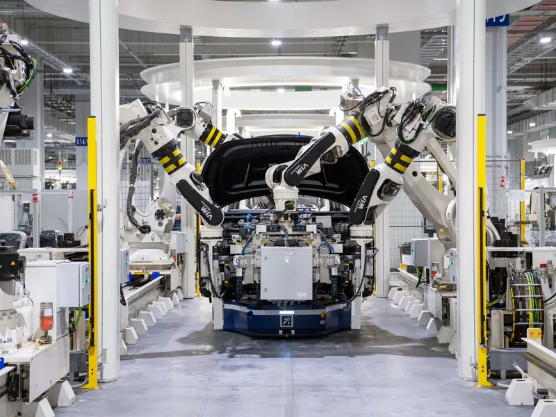 Robots assembling car bodies in a factory – automotive industry