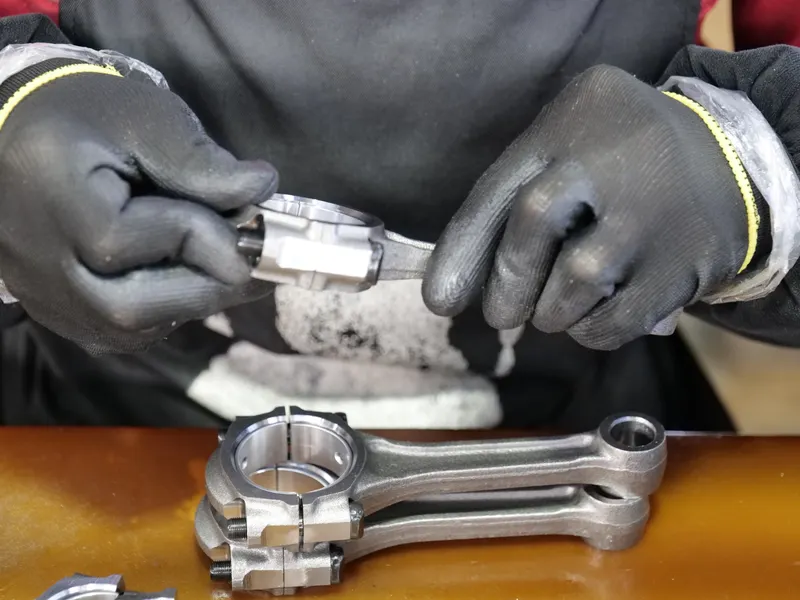 Technician assembling a metal part – general assembly industry